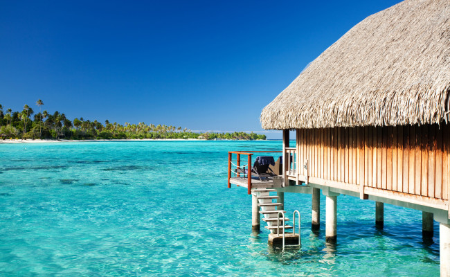 Over water bungalow with steps into lagoon